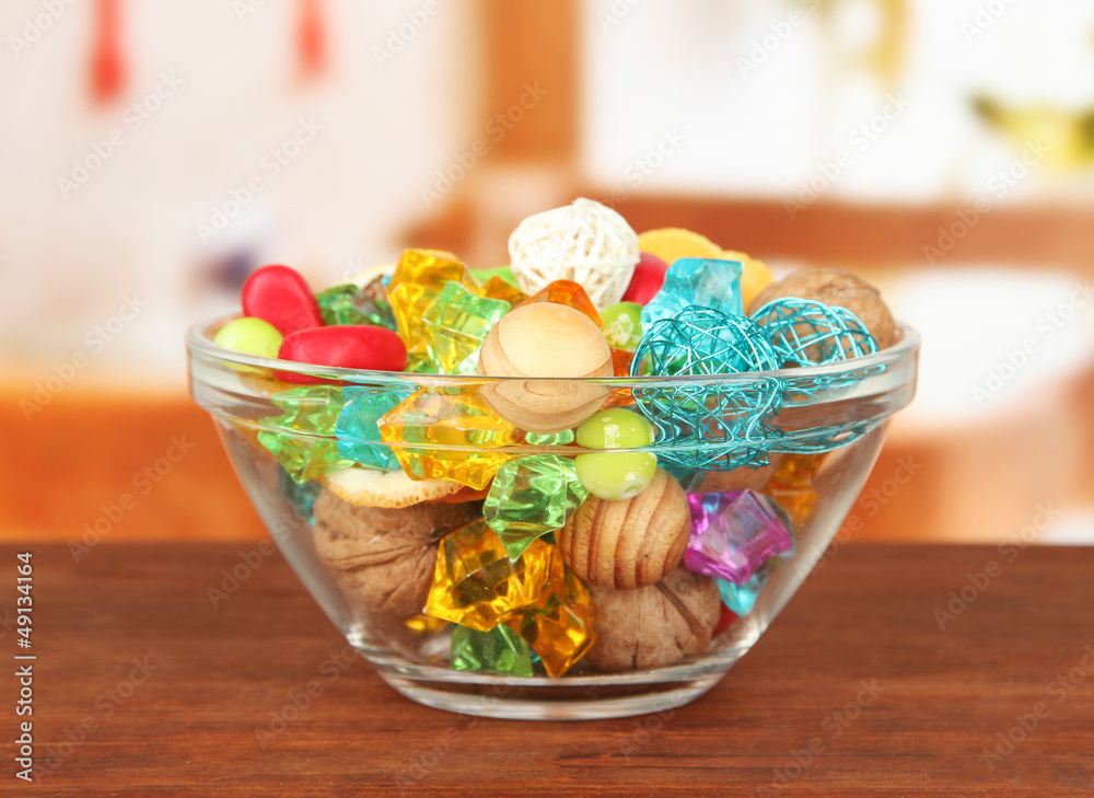 Fototapeta premium Dried oranges, wicker balls and other home decorations in glass