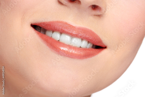 Woman smiling with teeth isolated on white background © Africa Studio