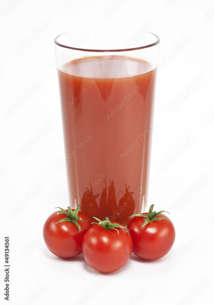 Cherry tomatoes and juice on a white background Cherry tomatoes and juice on a white background
