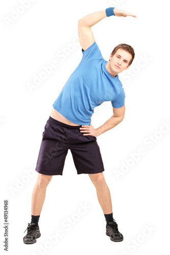 Full length portrait of a young man exercising