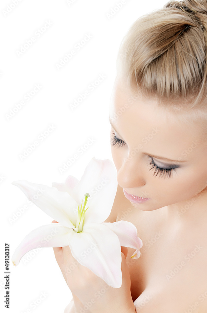 The beautiful blonde woman with lily flower The beautiful blonde woman with lily flower