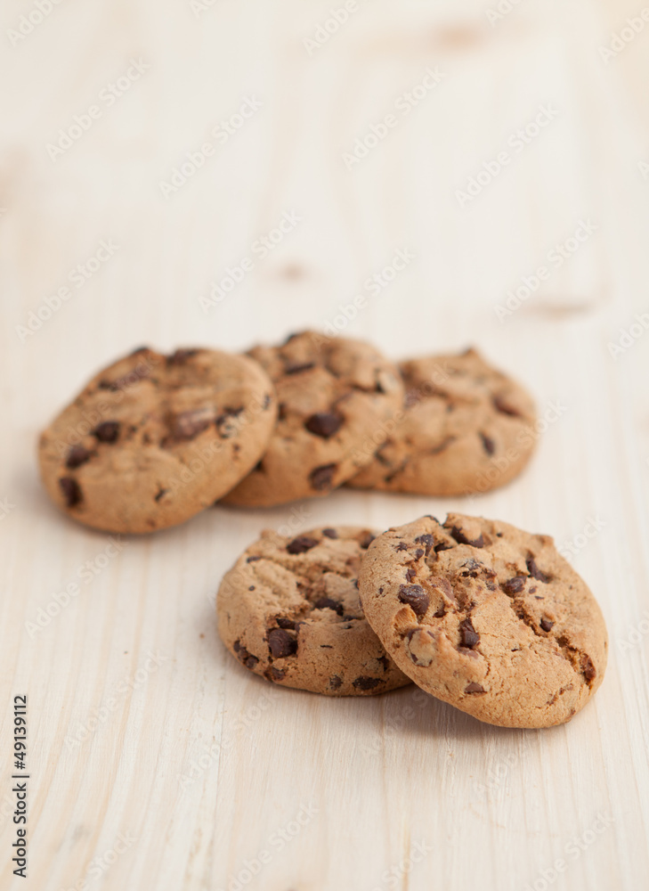 Chocolate chips cookies n a wooden table Chocolate chips cookies n a wooden table