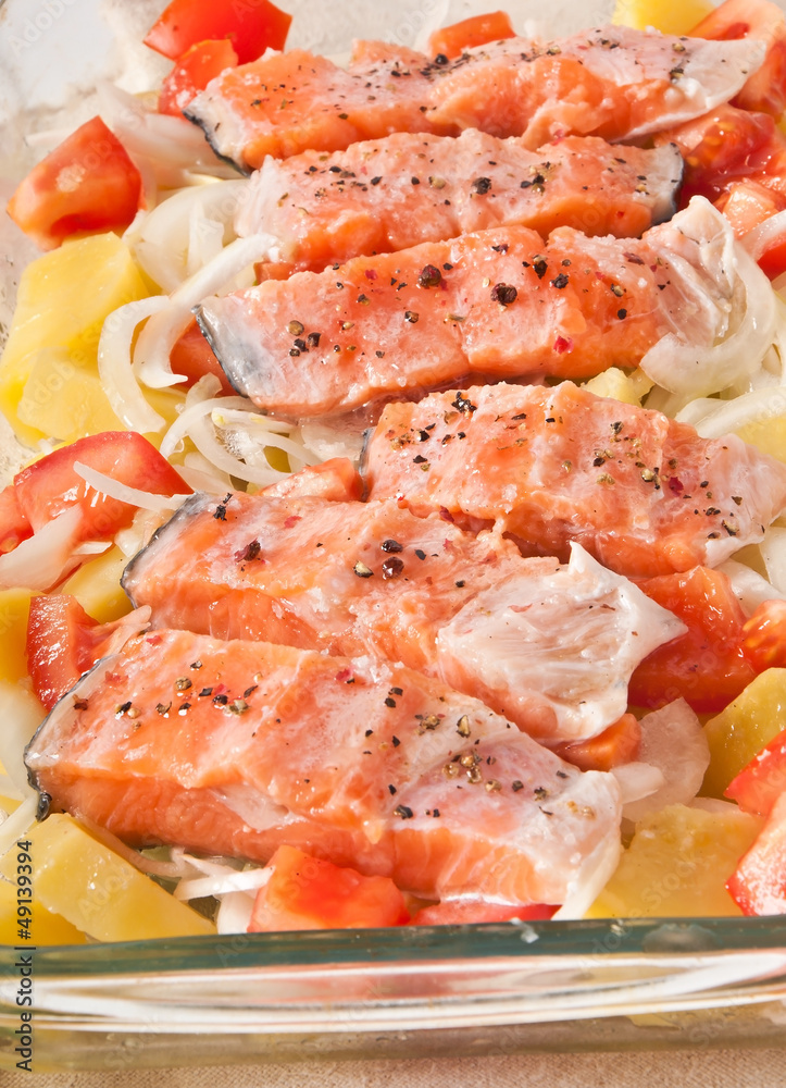 salmon with potatoes, tomatoes and onions prepared for baking salmon with potatoes, tomatoes and onions prepared for baking