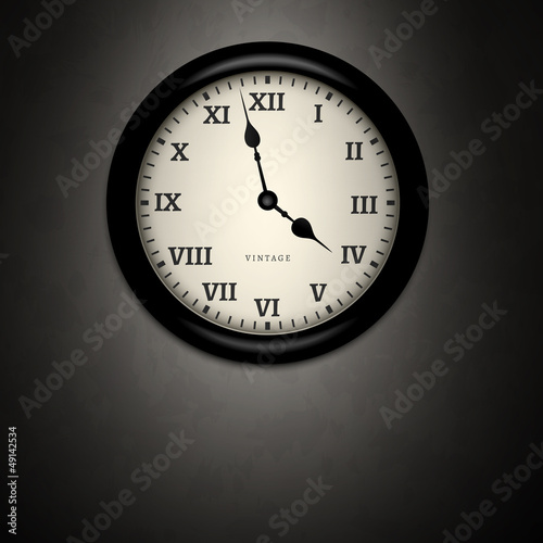 ..Black clock on dirty wall