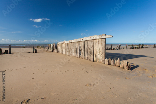 old marine wood in the beach in normandy © JPchret