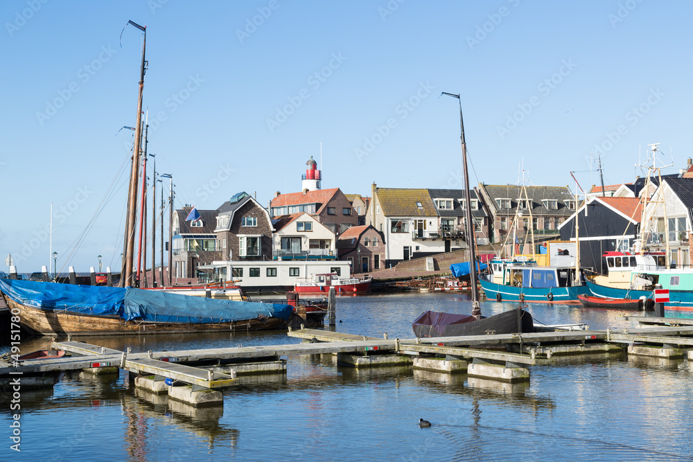 Historic Dutch harbor of Urk with lighthouse and old shipyard