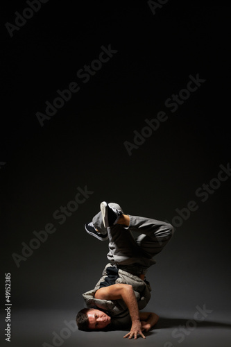 breakdancer posing over dark
