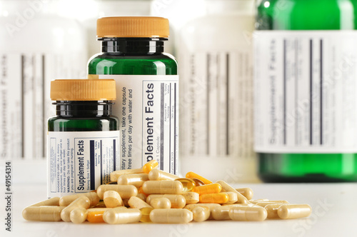 Composition with dietary supplement capsules. Drug pills