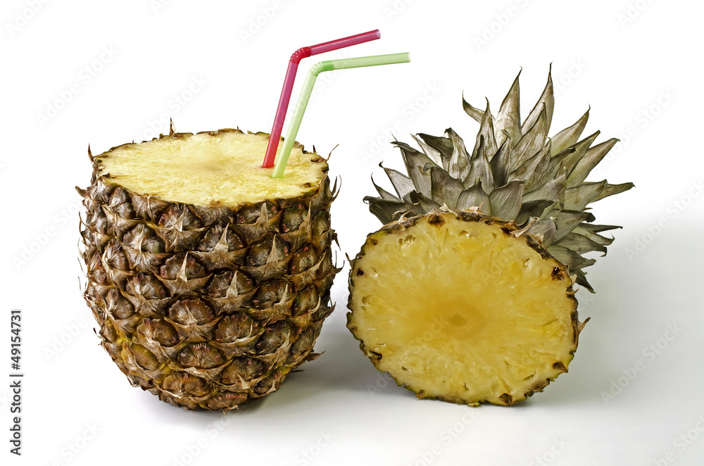 Pineapple with a straw for drinking fresh juice Pineapple with a straw for drinking fresh juice