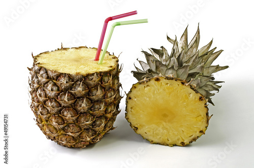 Pineapple with a straw for drinking fresh juice