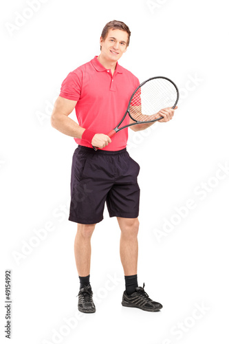 Full length portrait of a young man holding a tennis racket © Ljupco Smokovski