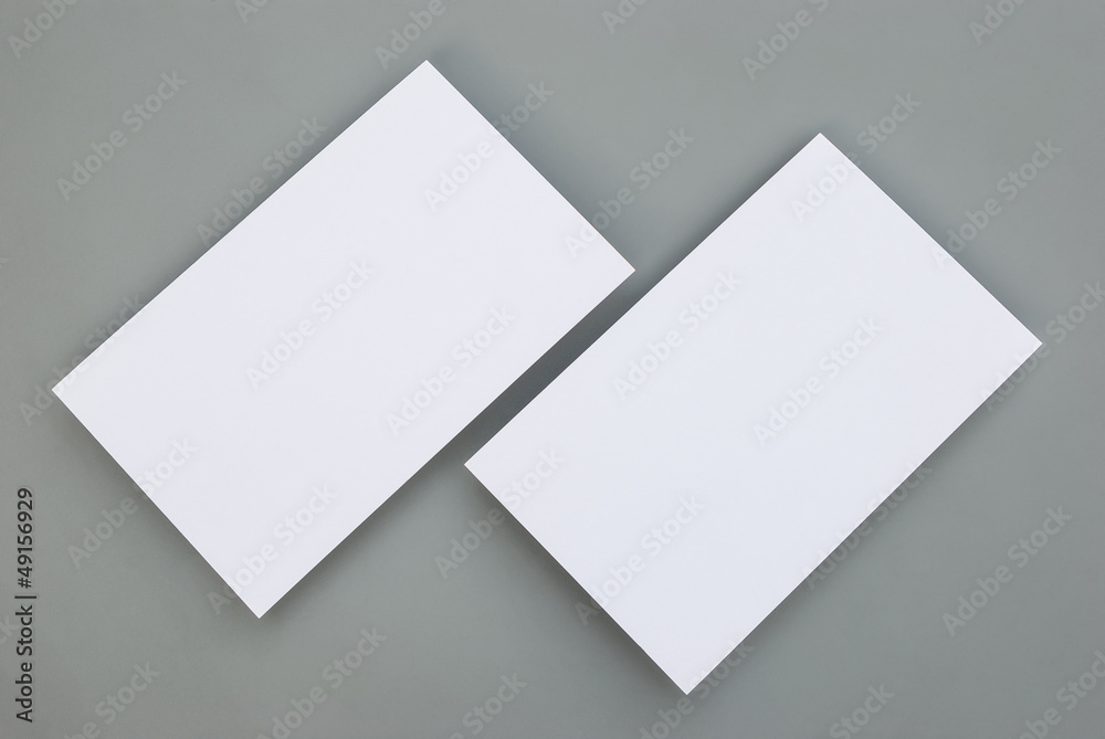 blank business cards on grey background