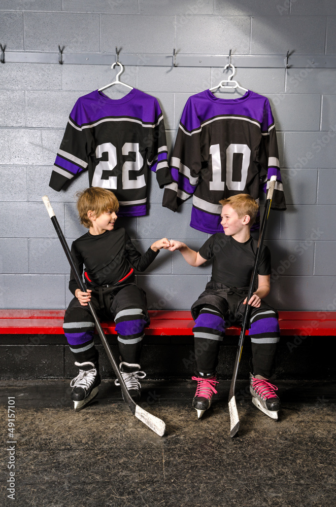 Fototapeta premium Youth Hockey Players in Fist Pump
