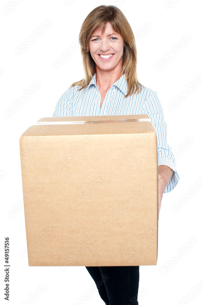 Attractive executive posing with a packed carton Attractive executive posing with a packed carton