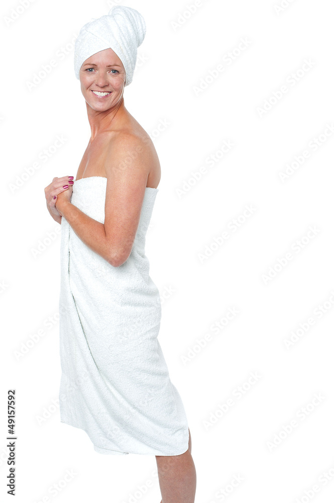 Gorgeous female in bath towel posing sideways Gorgeous female in bath towel posing sideways