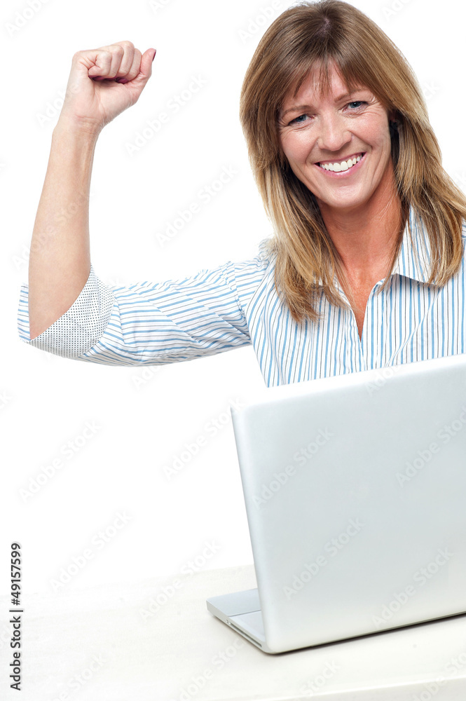 Excited businesswoman celebrating her success Excited businesswoman celebrating her success