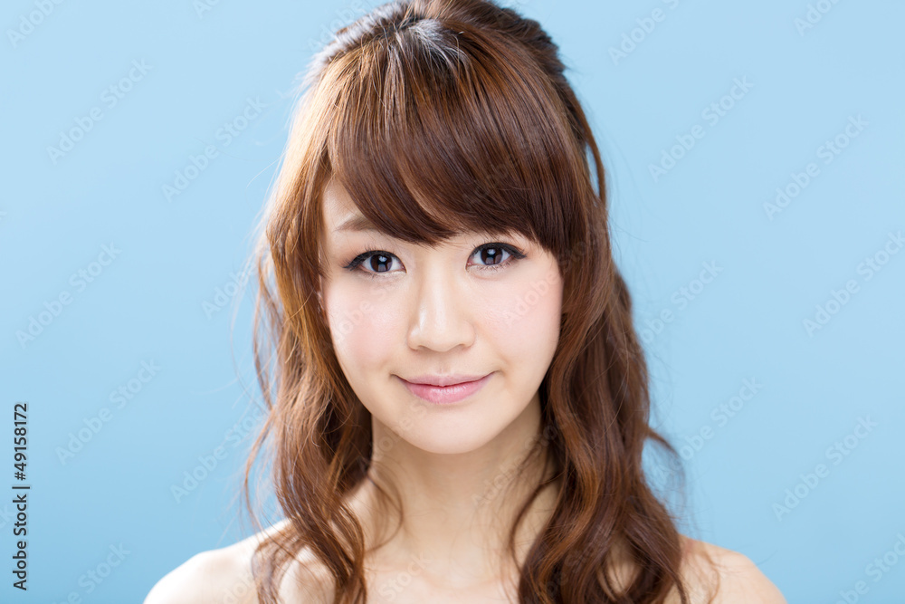 Beautiful asian woman on blue background Beautiful asian woman on blue background