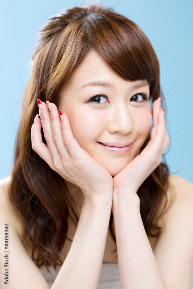 Beautiful asian woman on blue background Beautiful asian woman on blue background