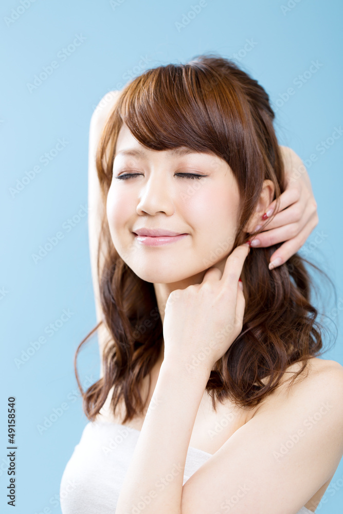 Beautiful asian woman on blue background Beautiful asian woman on blue background