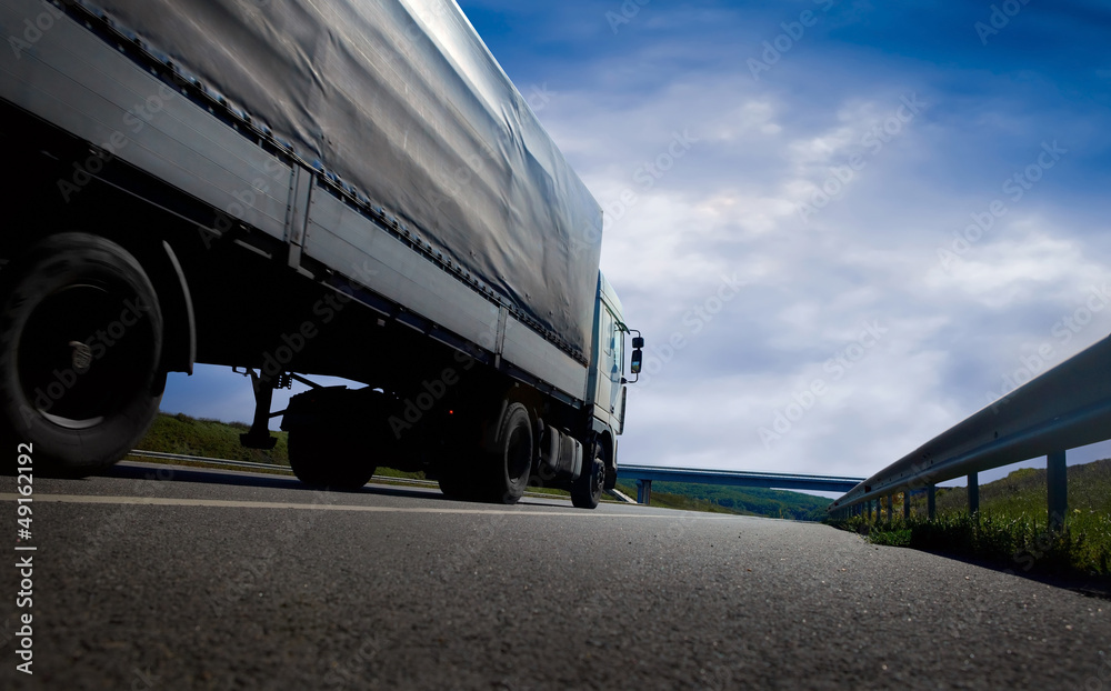 Beautiful view with truckcar on the road  under sky with clouds