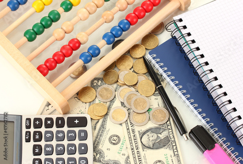 Bright wooden abacus and calculator. Conceptual photo of old