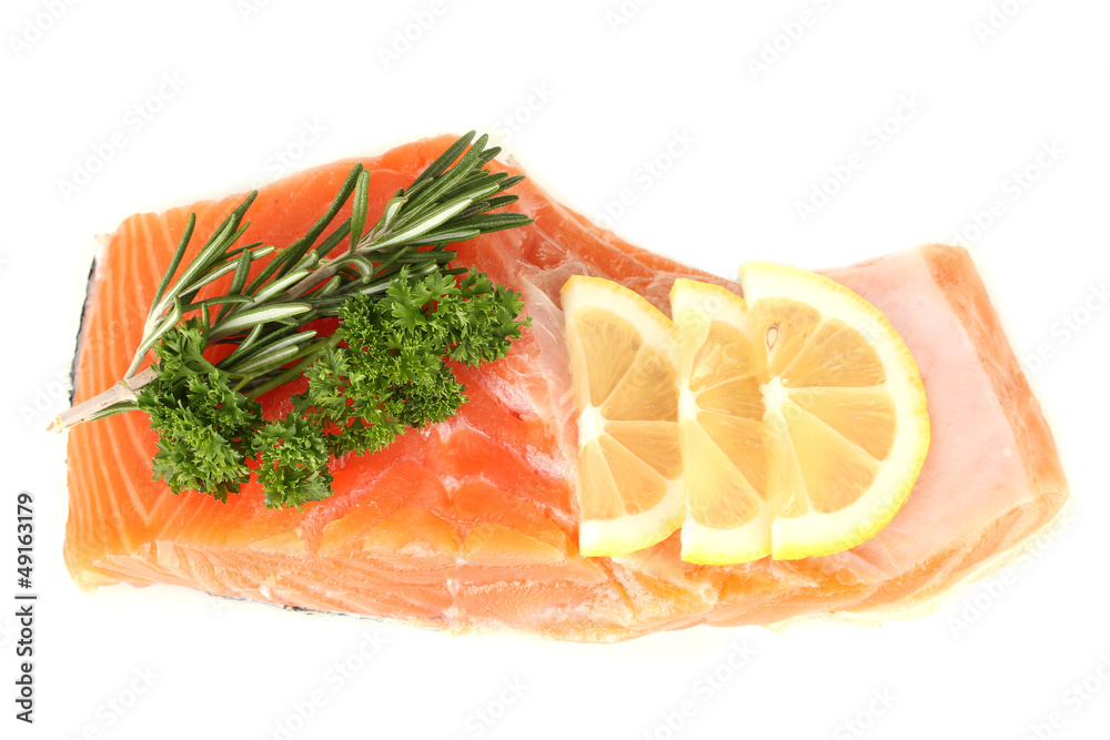 Fresh salmon fillet with herbals and lemon slices, isolated