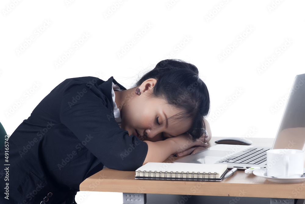 Tired business woman sleeping at her desk. Tired business woman sleeping at her desk.