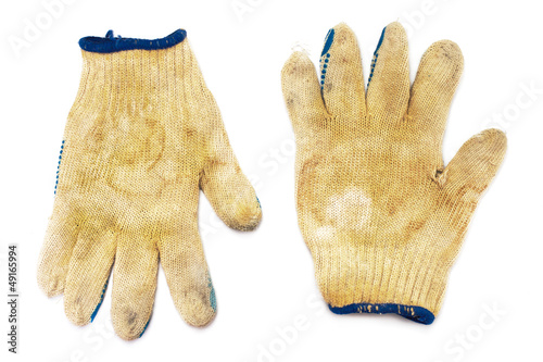 A pair of dirty gloves isolated on white