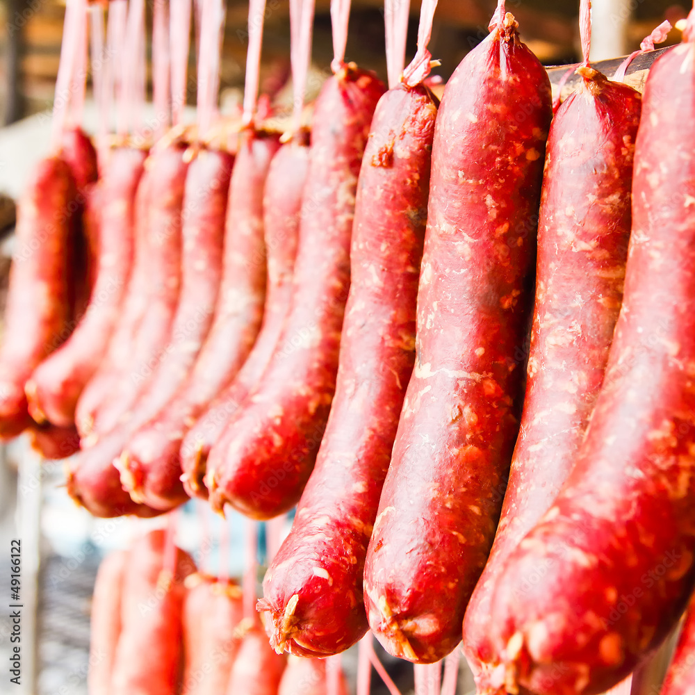Home made meat salami sausage at street market hanging in line u Home made meat salami sausage at street market hanging in line u