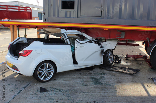 Konstfotografi A car that has crashed into a lorry trailer causing much damage