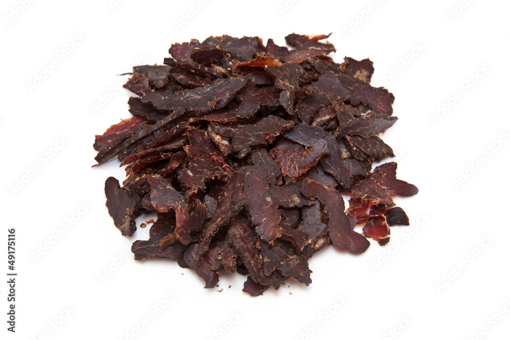 Sliced biltong isolated on a white studio background.