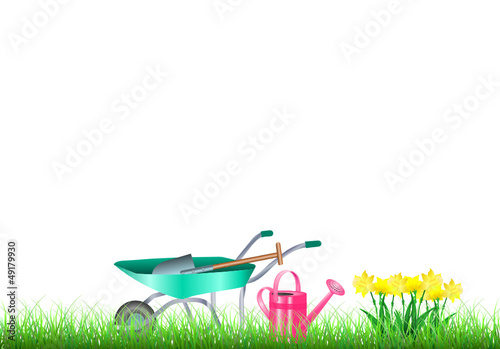 Gartenwerkzeug und Blumenbeet mit Narzissen