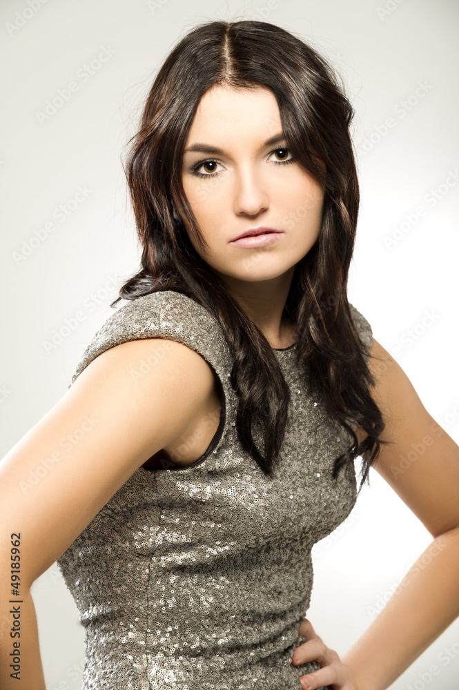 Beautiful woman in a silver dress Beautiful woman in a silver dress