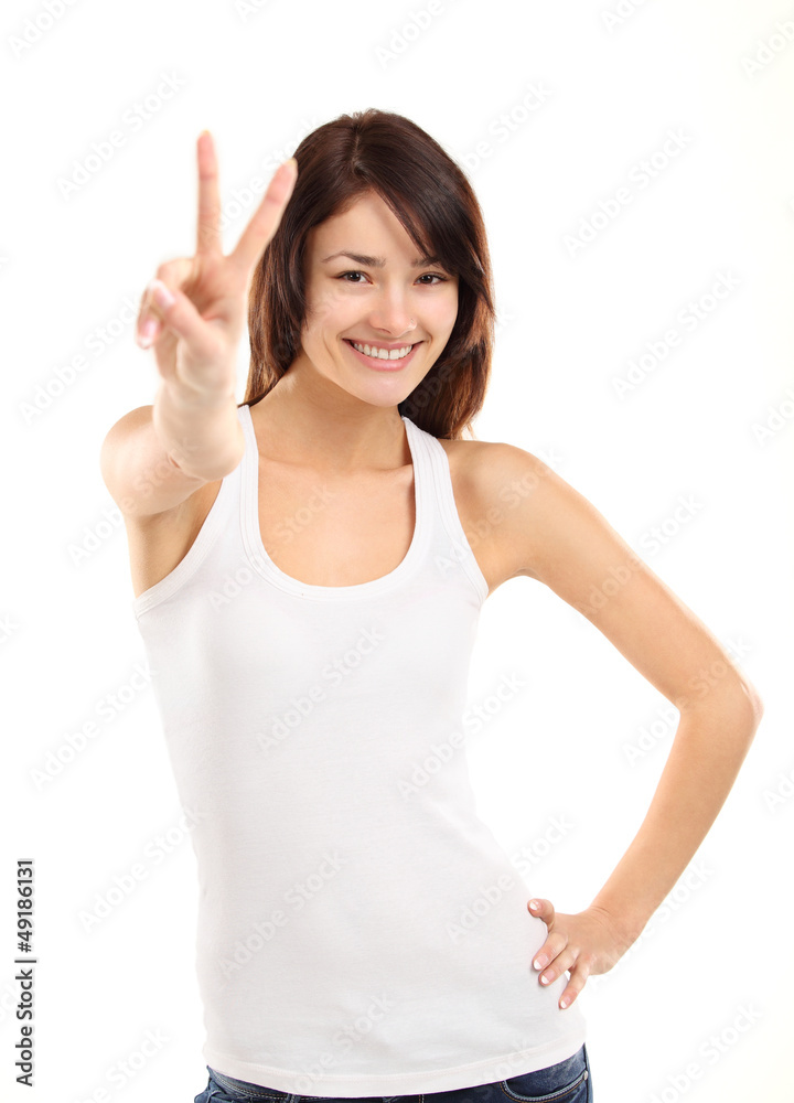 Portrait of a pretty young woman showing the peace sign Portrait of a pretty young woman showing the peace sign