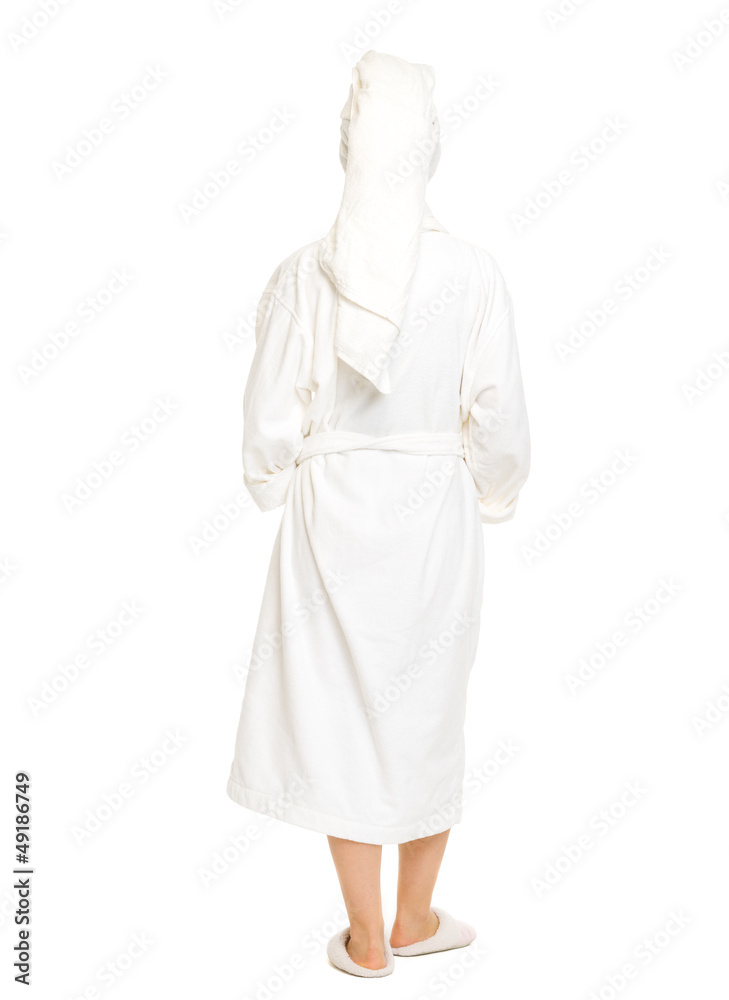 Full length portrait of woman in bathrobe. Rear view