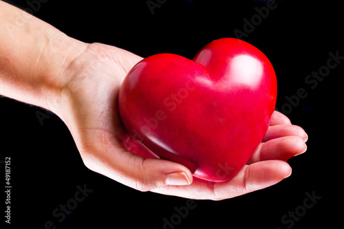 Heart on the palm as love and health symbol