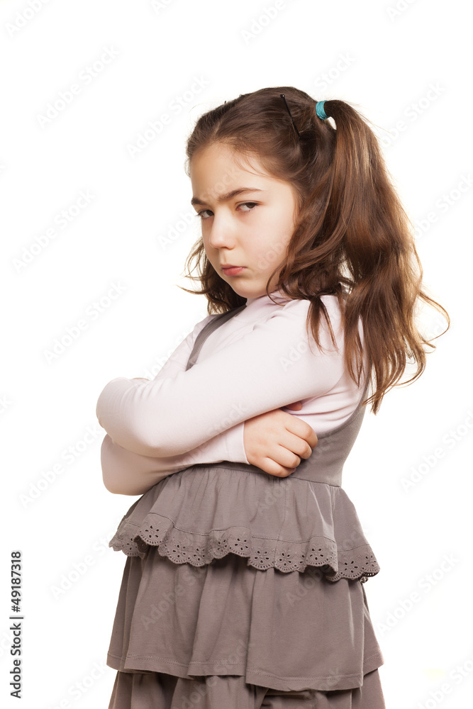 angry little girl in dress on white background