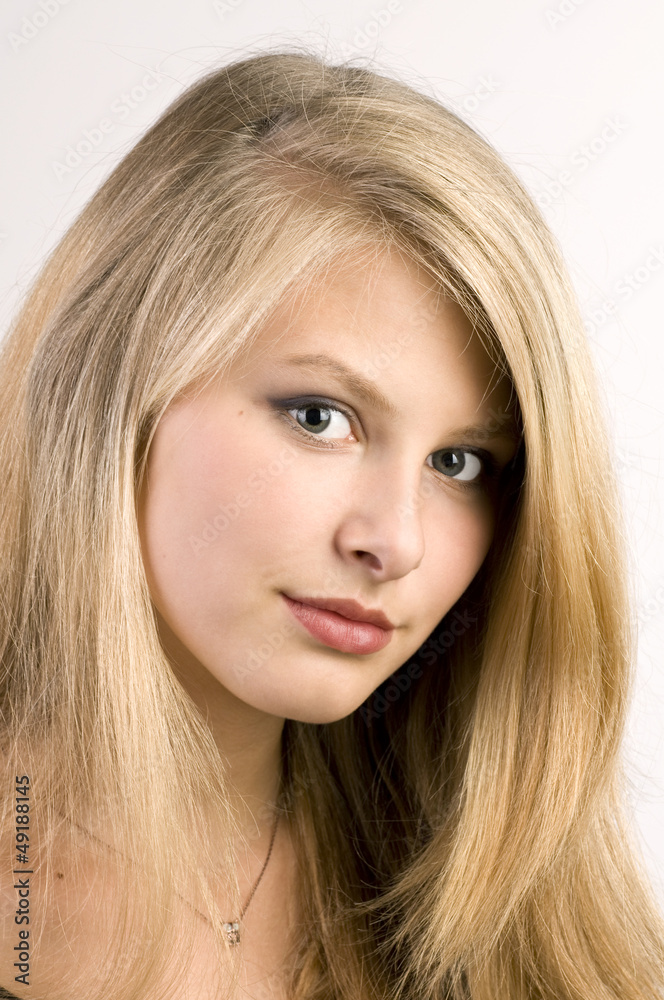 Young happy attractive girl posing in studio . Young happy attractive girl posing in studio .