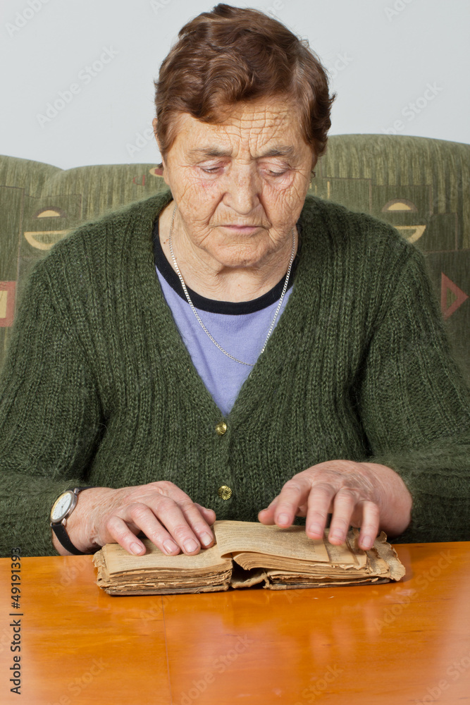 senior woman reading old book senior woman reading old book
