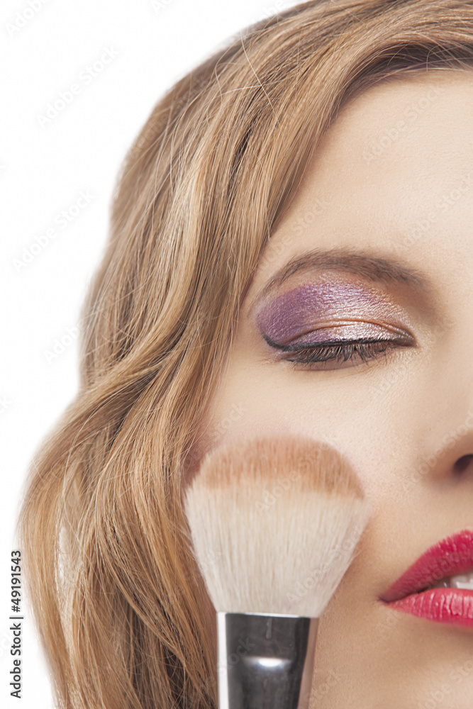 young woman with make-up brush young woman with make-up brush