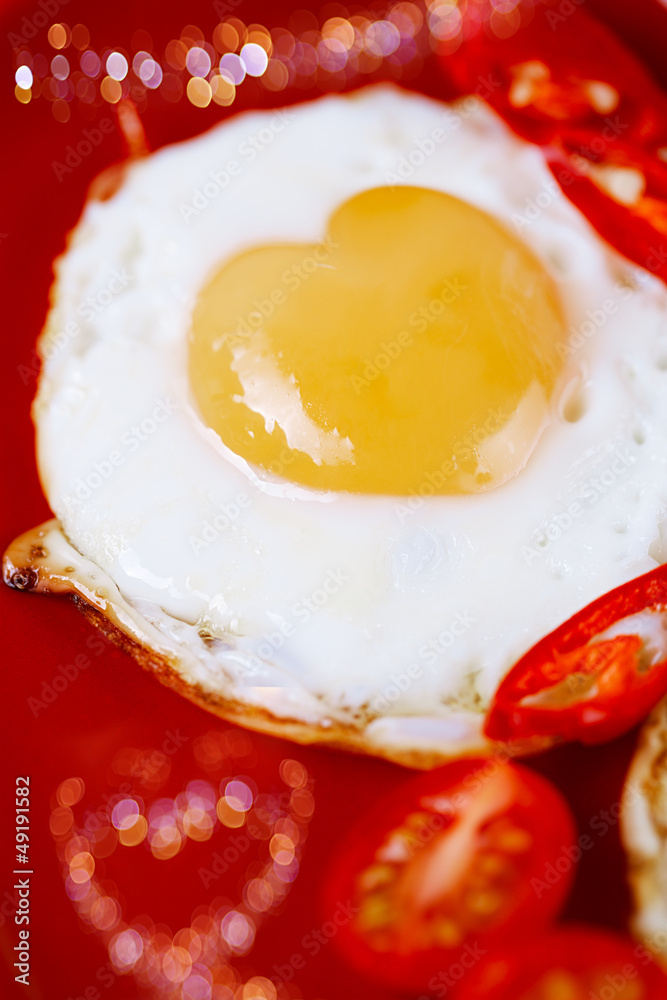 fried egg with heart shape yolks and heart shaped bokeh fried egg with heart shape yolks and heart shaped bokeh