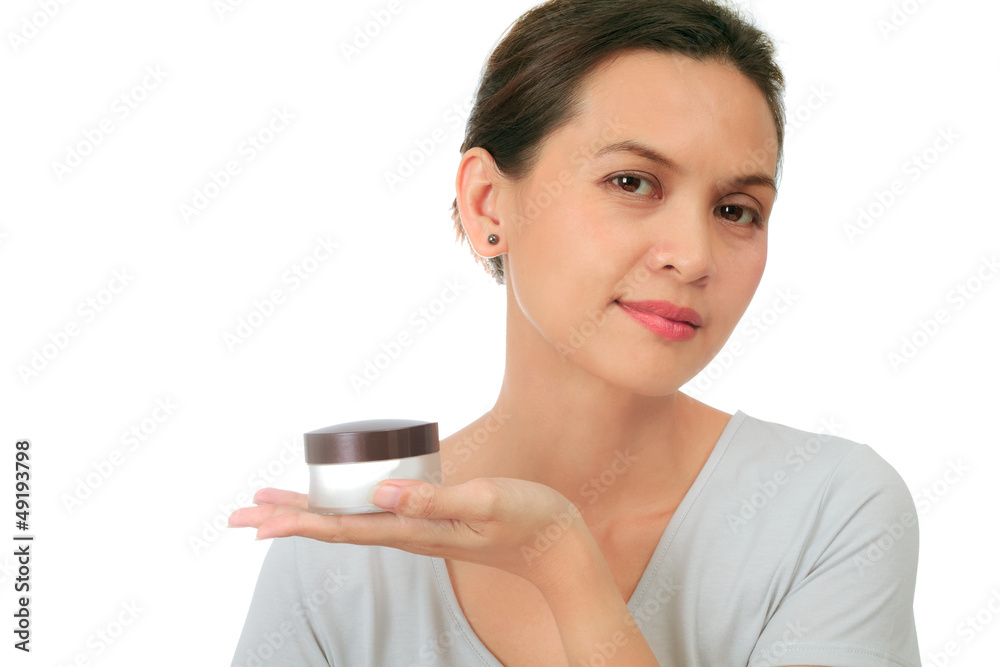 Isolated middle age asian woman with cosmetic cream Isolated middle age asian woman with cosmetic cream