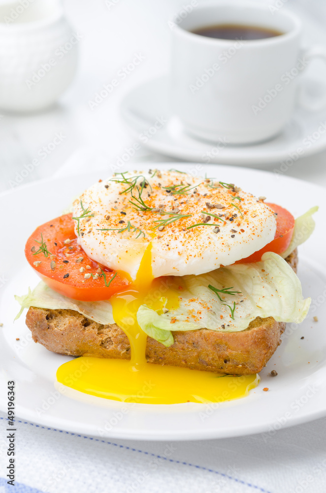 toast with tomato, lettuce and poached egg for breakfast toast with tomato, lettuce and poached egg for breakfast