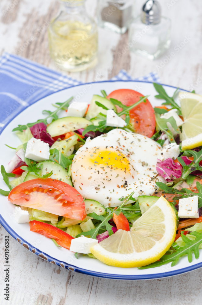 Vegetable salad with poached egg, vertical Vegetable salad with poached egg, vertical