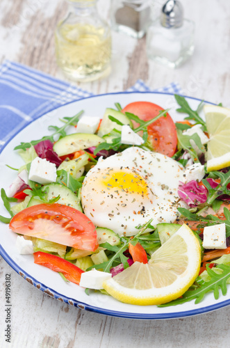 Vegetable salad with poached egg, vertical