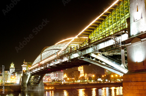 Illuminated bridge at night