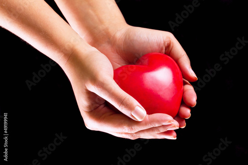 Heart on the palm as love and health symbol