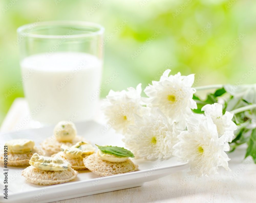 Several canapes and glass of milk Several canapes and glass of milk