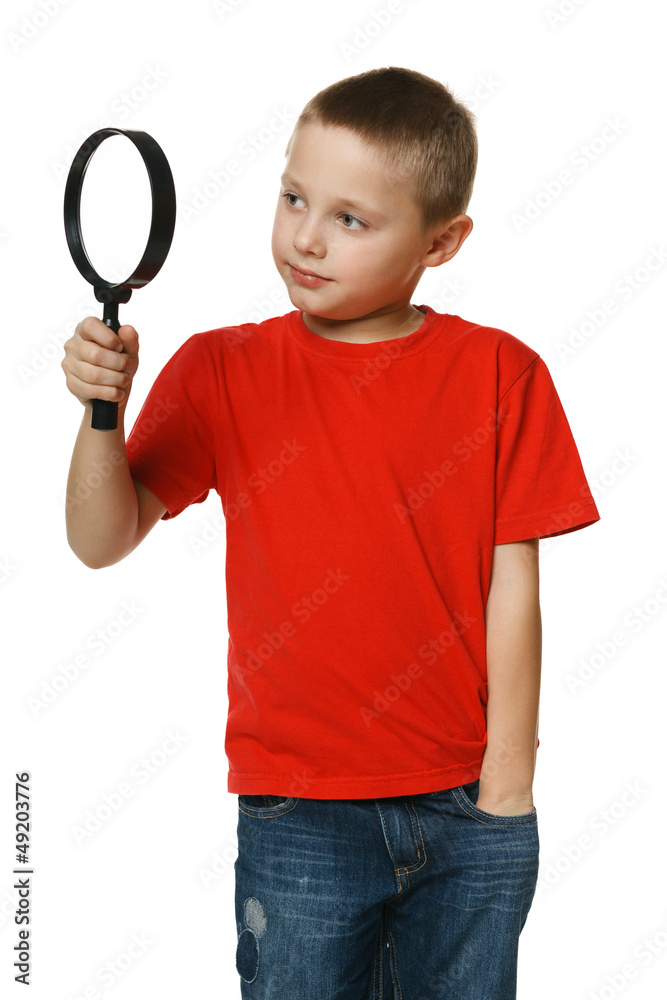 6 years boy looking through the magnifying glass 6 years boy looking through the magnifying glass