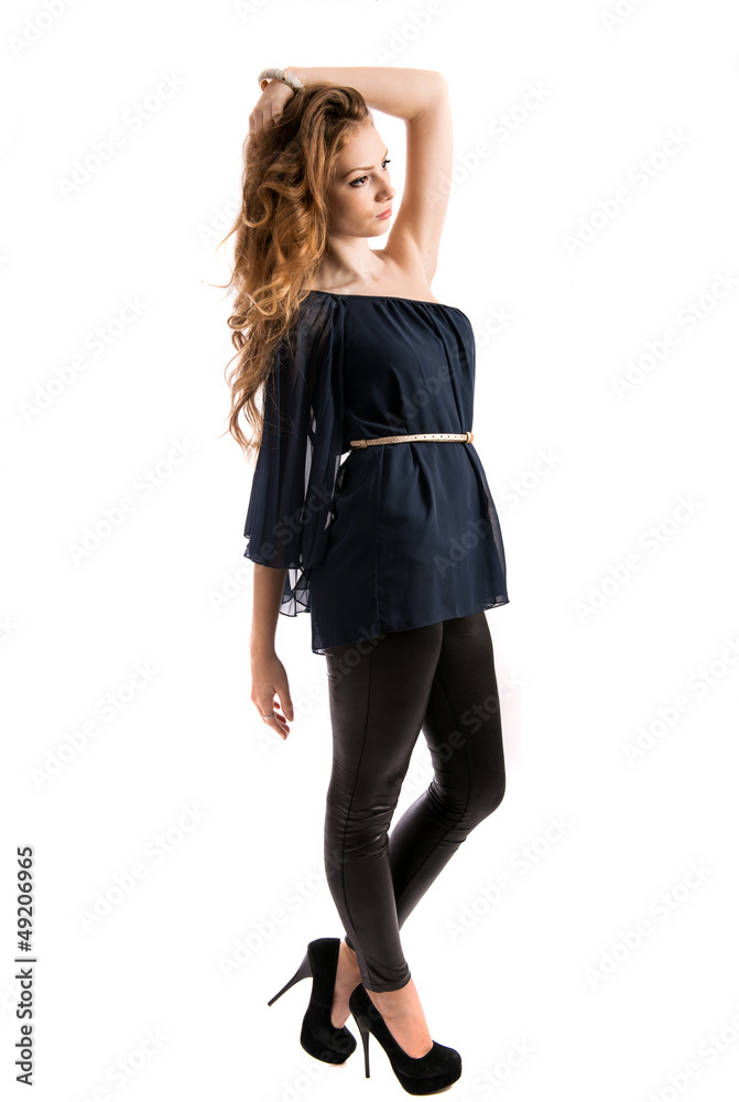 Fototapeta premium Beautiful blonde young lady posing in studio